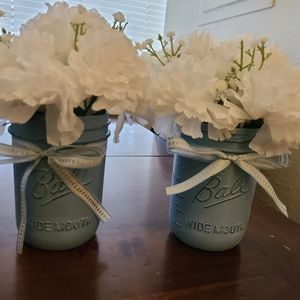 Set of two mason jars with fake flowers